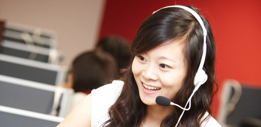 an english language student listening on a headset