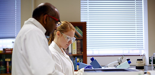 Tutor and student in a laboratory