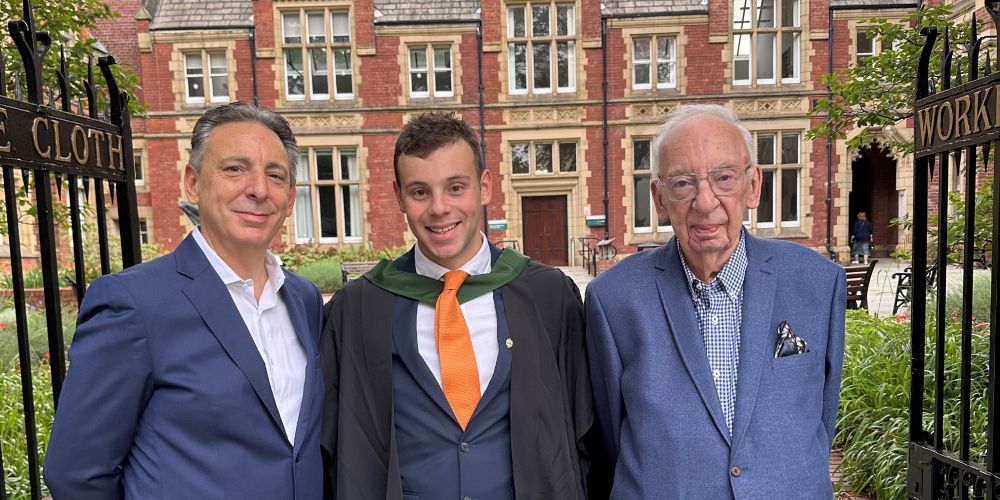 Matthew, Thomas and David Walsh stand under Clothworkers Court arch for a photo