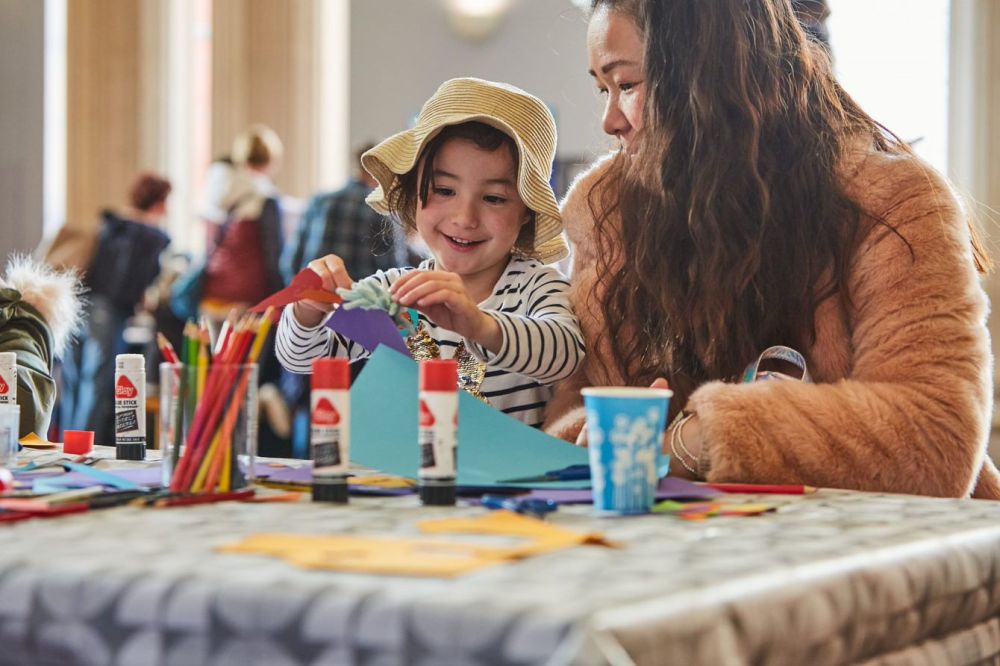 Parent and child crafting at the craft table