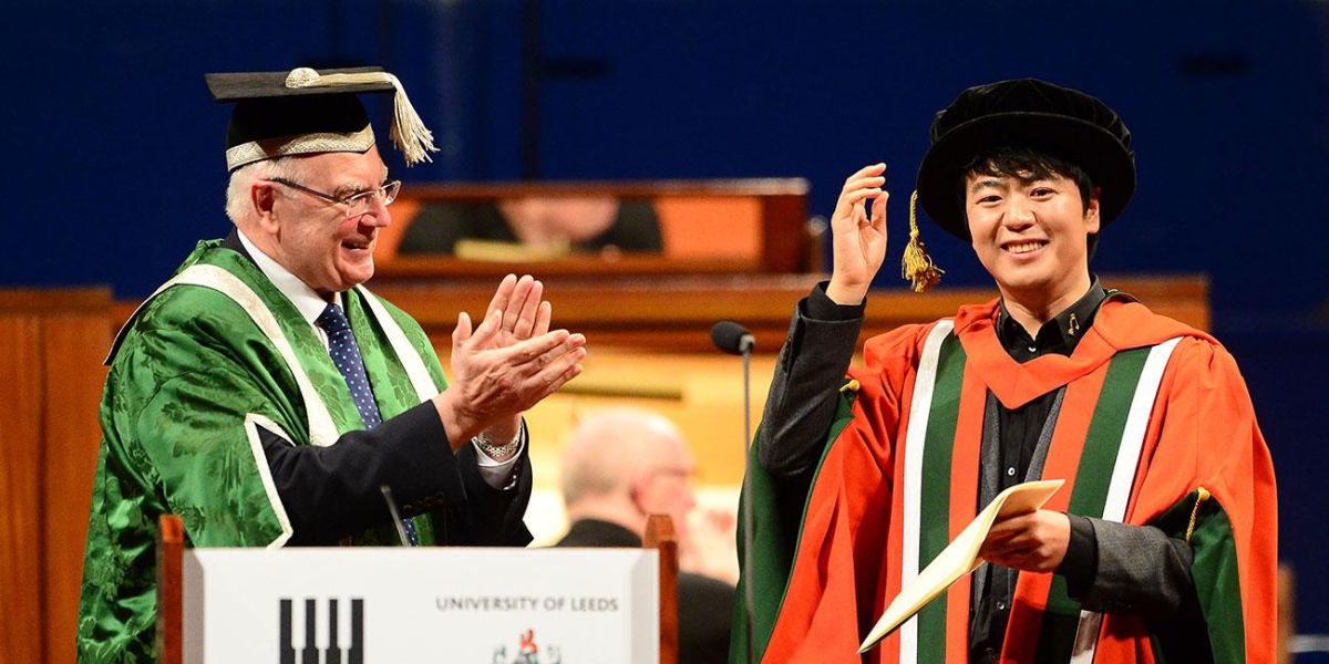 Lang Lang receives honorary degree from former Vice Chancellor, Sir Alan Langlands.