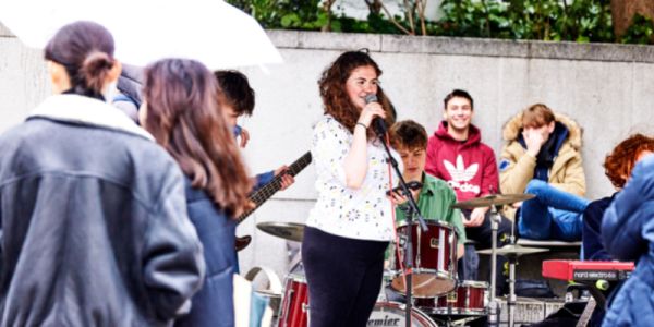 Band performing outside to a crowd