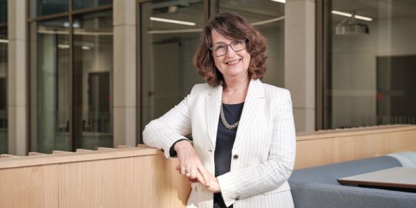 Professor Simone Buitendijk sitting on a chair and smiling