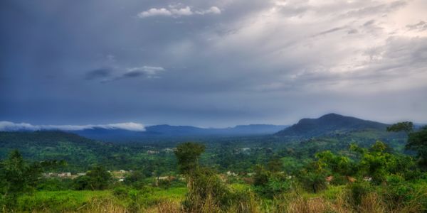 Storm clouds gather in the distance over bush country in Ghana