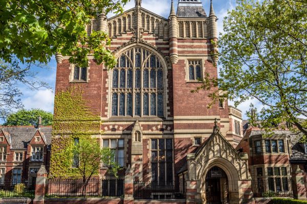 The great hall building at the University of Leeds, with trees at the side of the building