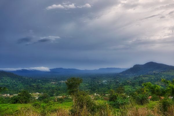 Storm clouds gather in the distance over bush country in Ghana