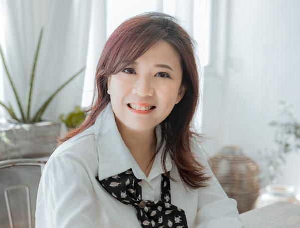 head and shoulders shot of person smiling at camera