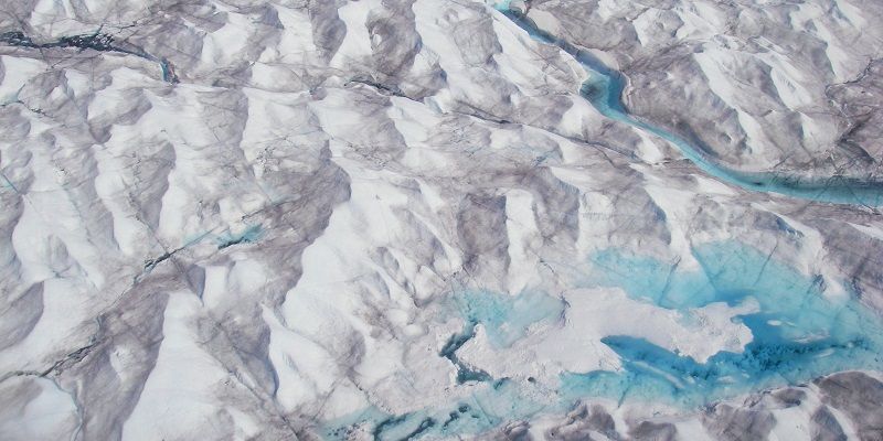 •	Surface meltwater ponding on dark ice (Credit C F Dow)