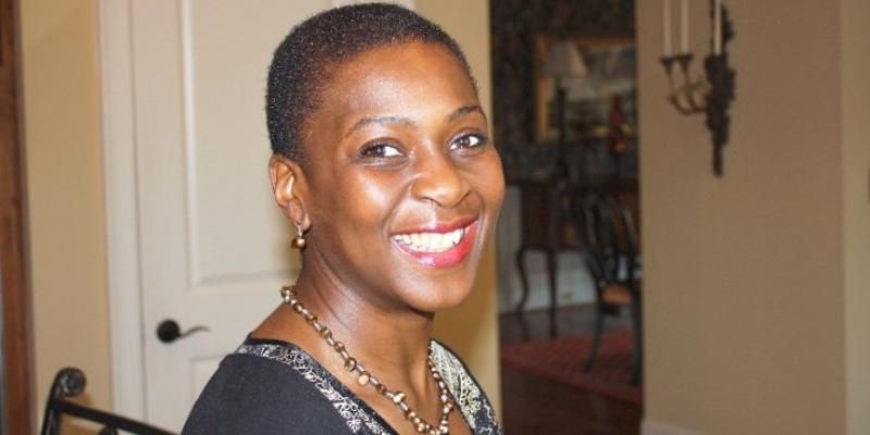 Professor Iyiola Solanke is standing in a sitting room