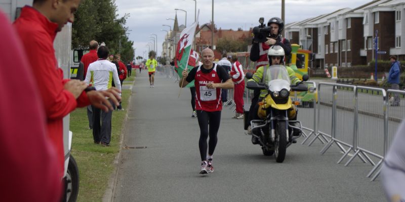 John Pares runs to the finish line in the 24 hour race