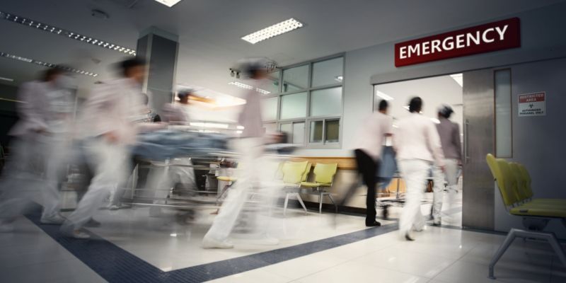 Doctors rushing into A&E with a patient on a trolley