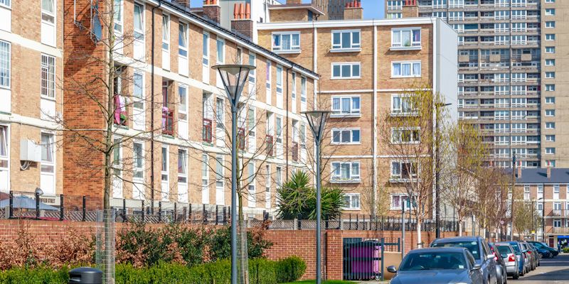 Mixed housing including blocks of flats and row of terraced homes.