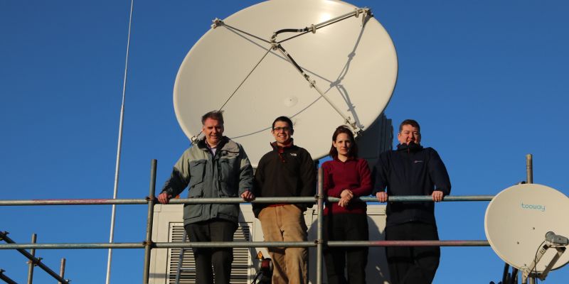 (From left-right) Jim Sharp (Met Office), Dr Ryan Neely (NCAS/University of Leeds), Dr Lindsay Bennett (NCAS/University of Leeds), Michael Cranston (SEPA) in front of the NCAS X-band Radar.