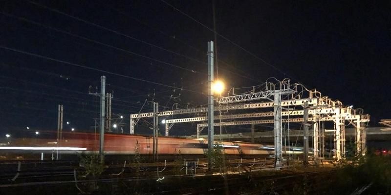 The photo shows a high-speed train passing an static frequency converter on the east coast main line. The static frequency converter delivers power to the railway line.