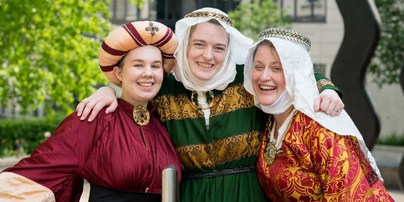 Sharna Connolly, Rose Sawyer and Dr Marta Cobb model medieval gowns on Leeds campus.