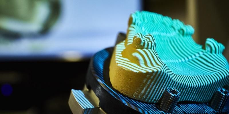 A tooth mould undergoing 3D scanning.