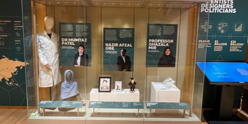 Objects on display at 'Muslims in the North' including a lab coat, Islamic headscarf, Commonwealth Games mascot and family photos