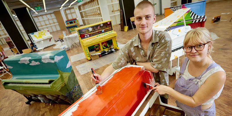 Recent University of Leeds Fine Art graduates Ollie Getley and Sophie Bullen start work on one of the Leeds Piano Trail instruments