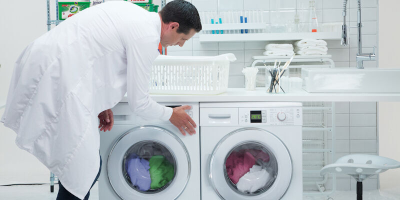 Washing is loaded into a machine at P&G's Newcastle Innovation Centre. Credit: P&G