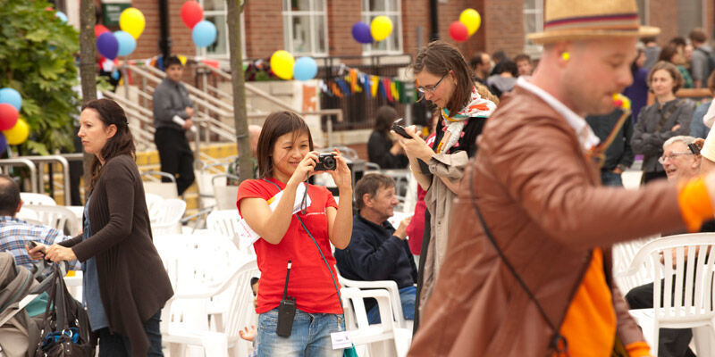 A member of staff takes a photo at the colourful annual staff festival.