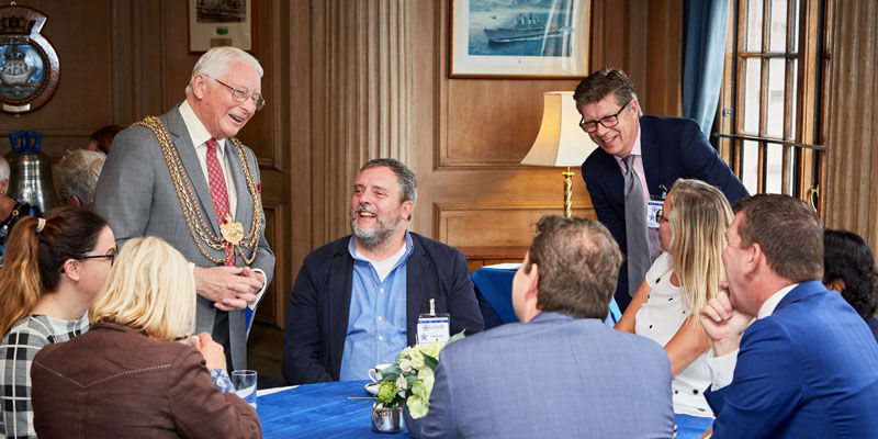 The Mayor at table with people involved in the project