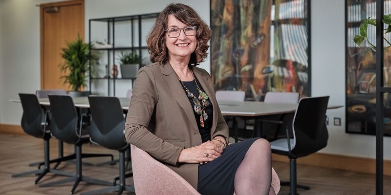 Professor Simone Buitendijk sitting on a chair and smiling