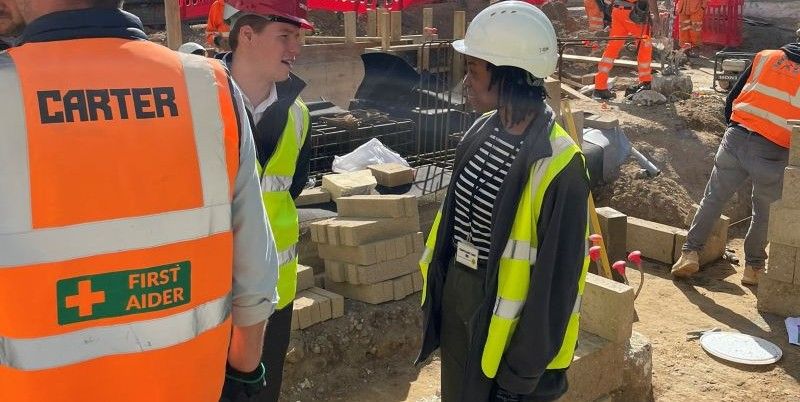 Shamiso O'Mard on a building site wearing a hard hat