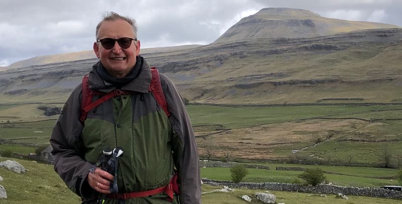 Jonathan Wild standing in front of Ingleborough mountain, the site of the Wild Ingleborough project