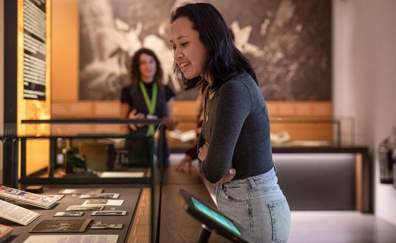 Student looking at items in the Treasures of the Brotherton Gallery