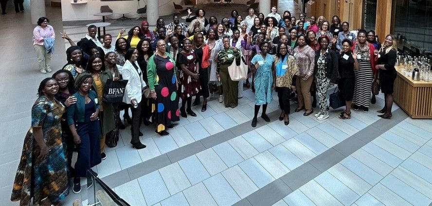 A large group of BFAN members in the Nexus atrium.