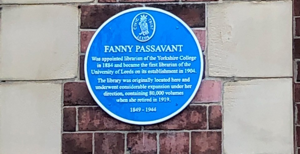 A Blue Plaque honouring Fanny Passavant, firext Librarian at the University of Leeds,  pictured on a brick wall