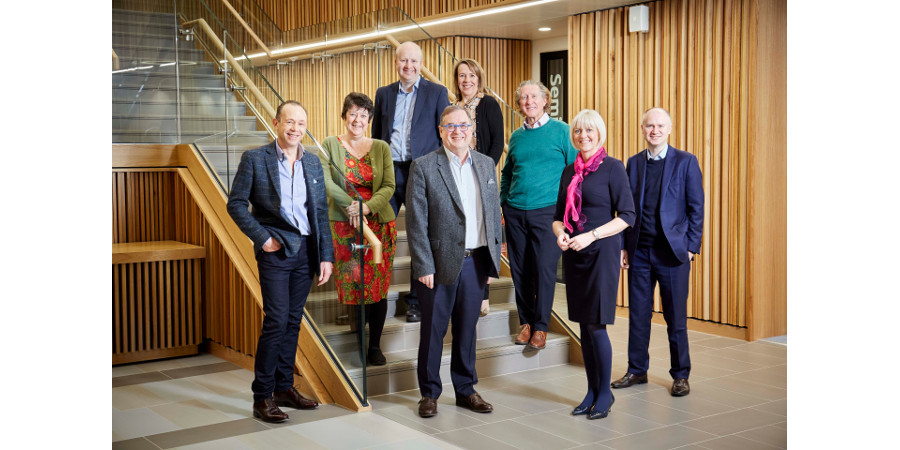 Photo of Team Leeds. From left to right, standing on a staircase is, 
Martin Stow, Director, Nexus, and 
Jo-Anne Wass, Director, Leeds Academic Health Partnership, and
Thomas Bridges, Director, Arup, and 
Roger Marsh, Chair, Leeds City Region Local Enterprise Partnership, and
Justine Andrew, Market Director, KPMG's Education and Skills, and
David Aspin, Founder, Monroe K, and 
Lisa Roberts, Deputy Vice-Chancellor: Research and Innovation, University of Leeds, and
Tom Riordan, Chief Executive, Leeds City Council
