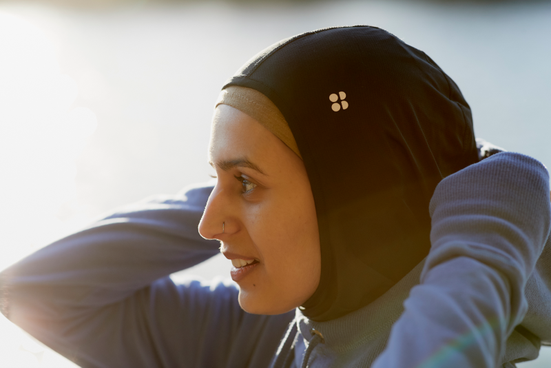 Namrah Shahid wearing a hijab with the Sweaty Betty logo on.