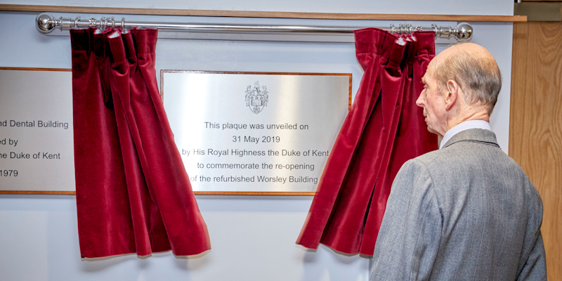 Duke of Kent stands by an old and new plaque