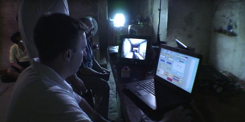 The image shows the research team remotely operating the the robot while sat inside the Queen's Chamber inside the Great Pyramid.