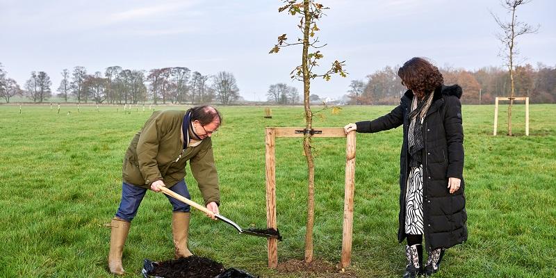 Roger Gair and Professor Simone Buitendijk, the Vice-Chancellor, planting at tree at Gair Wood