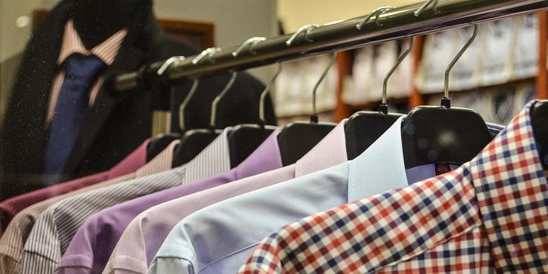 The image shows a clothes rail displaying shirts in a clothing store