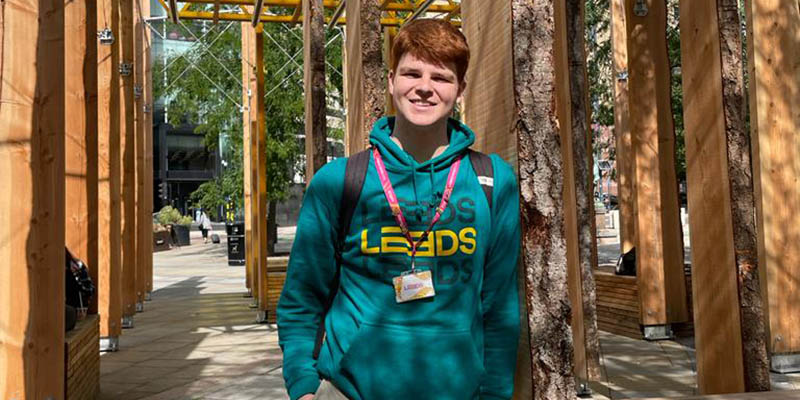 Student Richard O'Brien, smiling in a Leeds 2023 hoodie.
