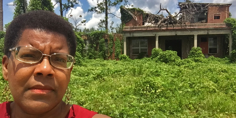 Tananarive stands outside the infamous Dozier School for boys.