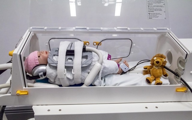 Doll inside Baby MRI Incubator.