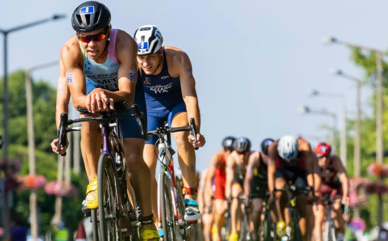 Tyler Smith races on his bike during triathlon race