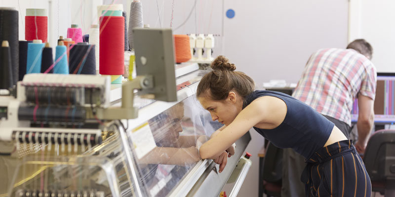 Overseeing one of the new high-tech knitting machines in the School of Design's 3D Weaving Innovation Centre