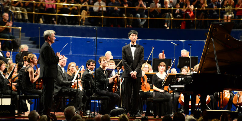 Eric Lu, winner of the 2018 Leeds International Piano Competition with Edward Gardner, conductor, and the Halle orchestra at the finals.