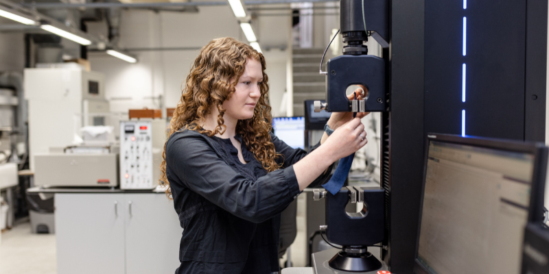 A researcher puts a garment through its paces at testing station