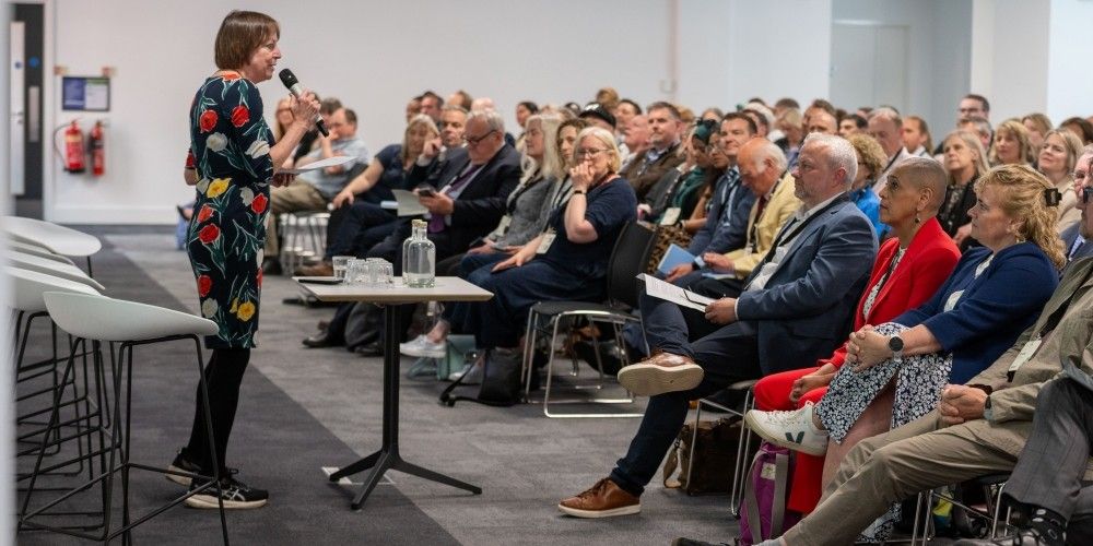 Professor Shearer West presents the Civic Exchange to a large room full of people sat in the audience.