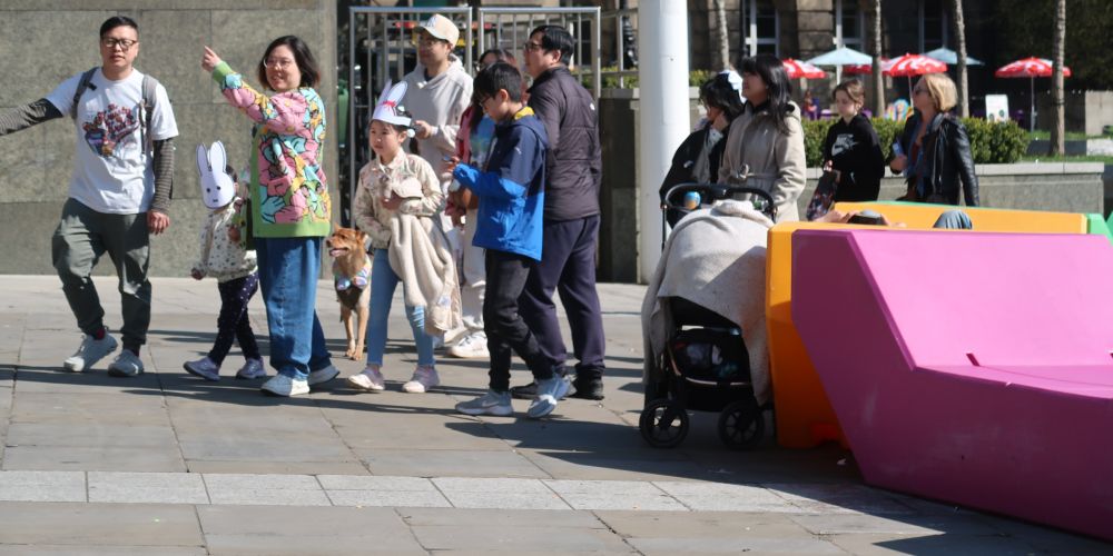 Families play in Leeds Millenium square