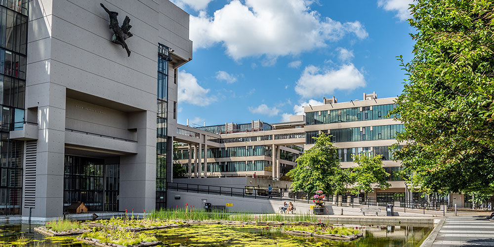 Roger Stevens building and pond on a sunny day