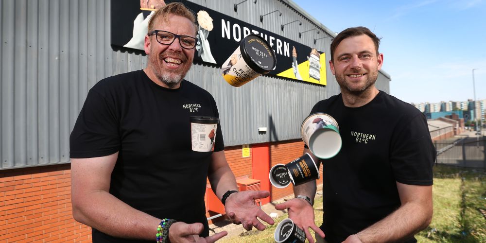 Leeds alum Dirk Mischendahl and co-founder Josh Lee juggle ice cream pots in front of the Northern Bloc factory