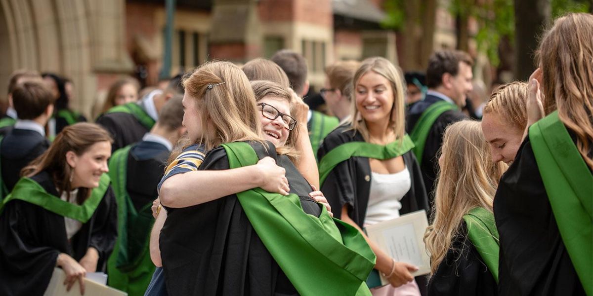 Group of students celebrating graduation from the University of Leeds