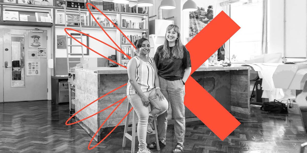 An academic and arts professional stood in a lab.